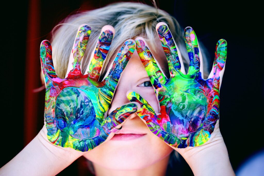 child messy hands paint rainbo scaled