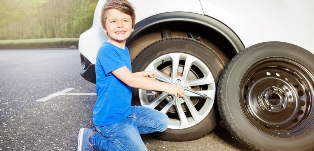 child changing tire